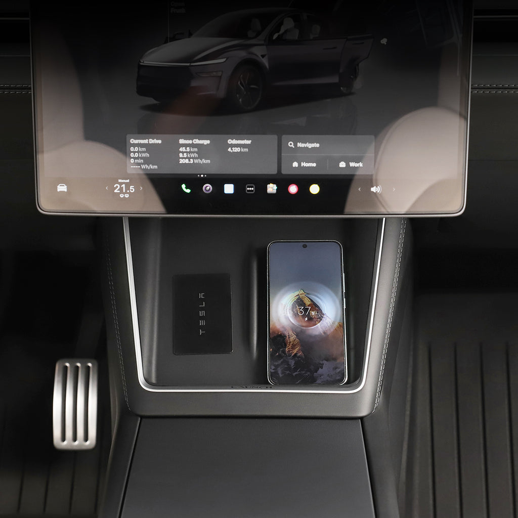 Car interior with a touchscreen display and smartphone on a silicone charging pad