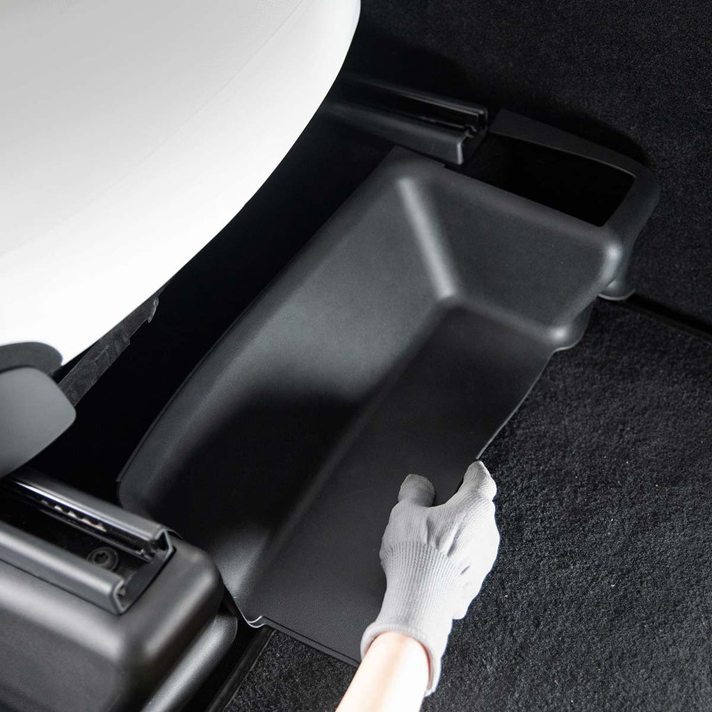 Model Y Juniper Seat Track Cover black TPE protection being installed under Tesla seat